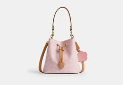 COAC* -Rowan Bucket Bag In Signature Canvas-Gold/Powder Pink