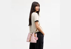 COAC* -Rowan Bucket Bag In Signature Canvas-Gold/Powder Pink